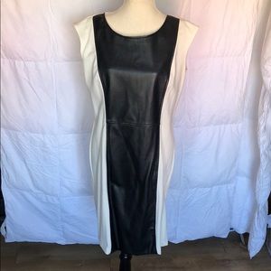 Spense Knee length ivory with faux leather insert.